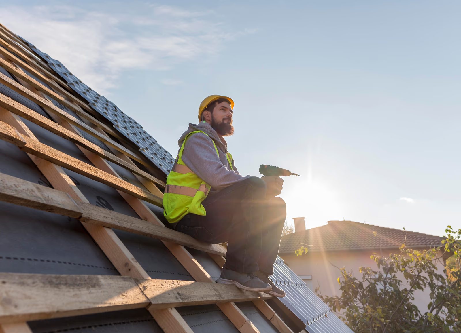 Professional solar panel installer at work in the UK