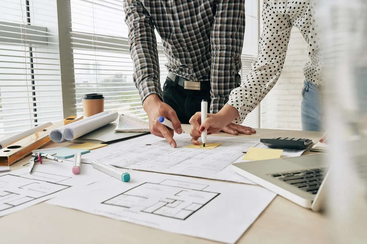 Tradesperson reviewing job blueprints — find local tradespeople near you