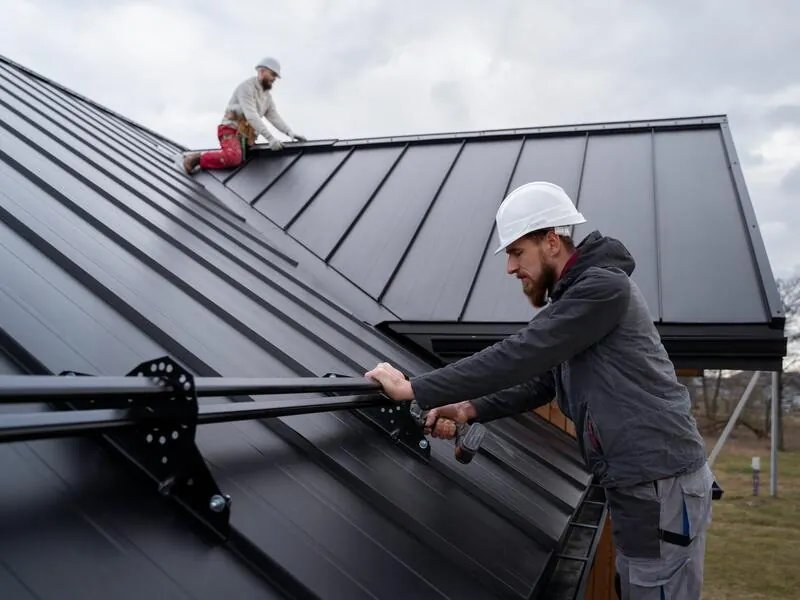 Roofer on a UK pitched roof — emergency roof repair